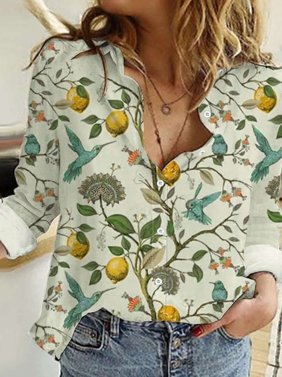 Woman wearing Bella Road Lemon Printed Collared Neck Long Sleeve Shirt with buttoned front and rolled-up sleeves.