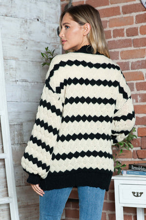 Woman wearing Bella Road Striped Contrast Open Front Long Sleeve Cardigan, cozy and stylish, perfect for layering.