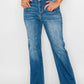 Woman wearing bytos full size distressed high rise jeans with pockets, showcasing vintage style and modern fit.