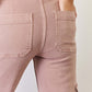 Back view of RISEN full-size high rise cargo wide leg jeans showcasing functional pockets in a flattering fit.