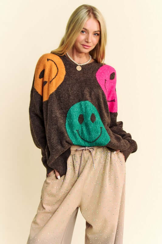 Davi & Dani oversized sweater featuring playful smiley faces in contrasting colors, perfect for a cozy and stylish casual look.