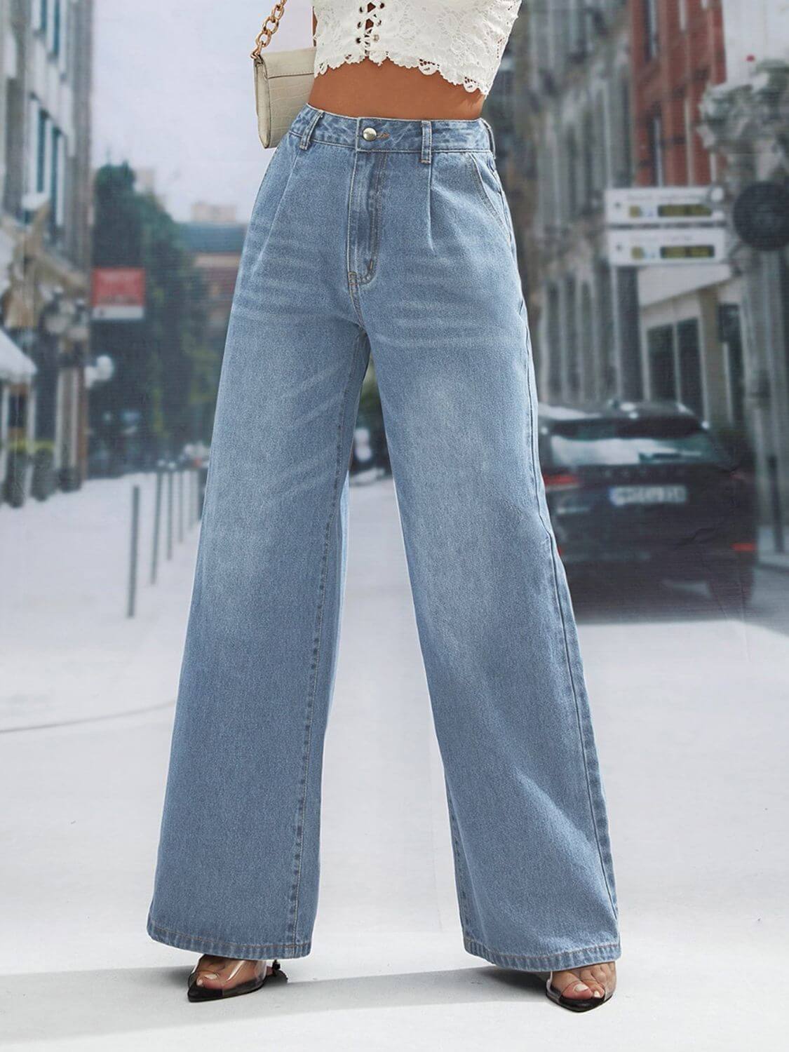 Trendy wide leg jeans with pockets, buttoned and slightly stretchy, made from 85% cotton and 15% polyester, perfect for a stylish street look.