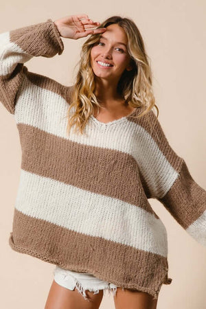 Woman smiles in a cozy BiBi Slit Striped V-Neck Sweater with wide stripes, showcasing a relaxed, stylish fit.