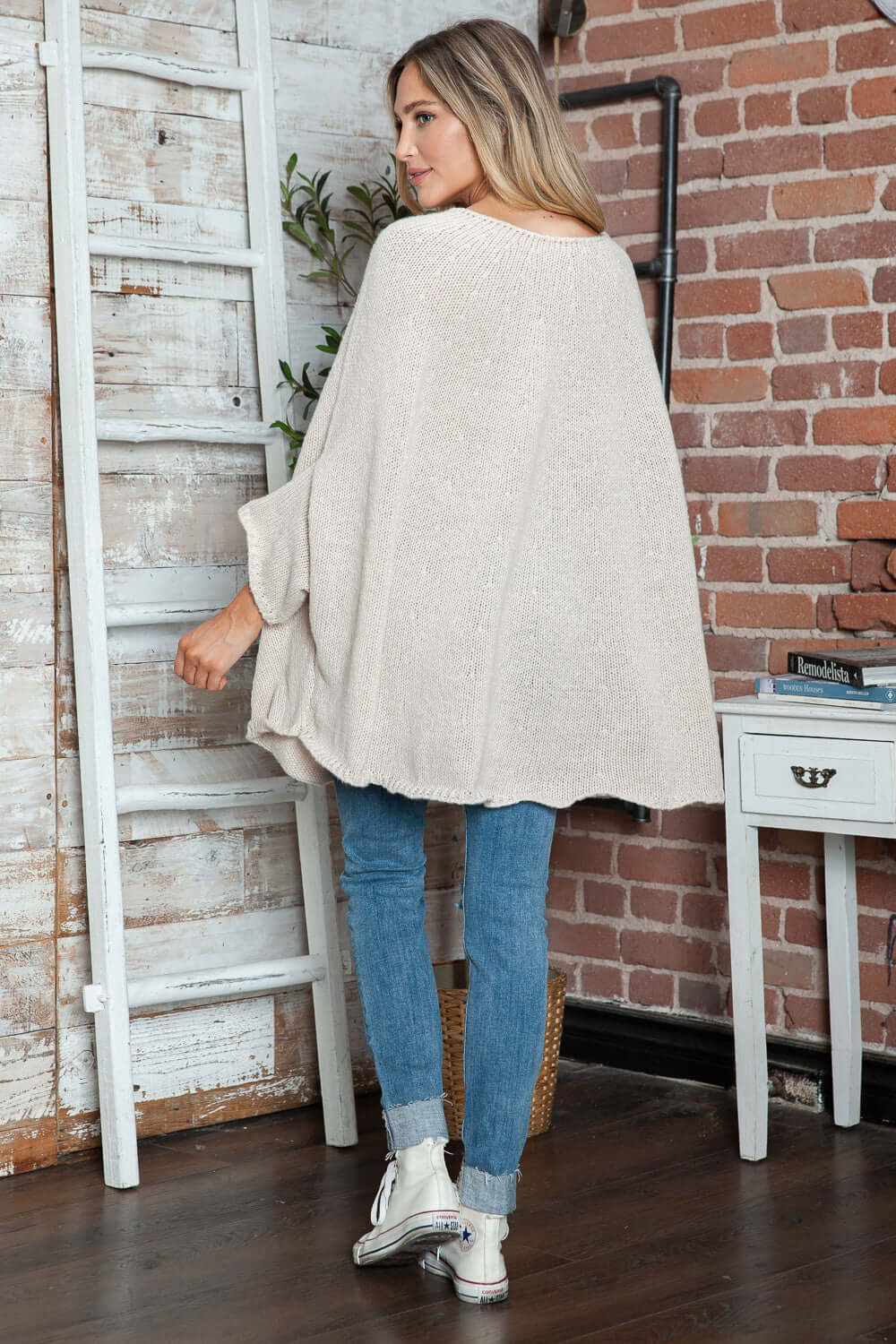 Cozy Bella Road Batwing Sleeve Sweater in stylish setting, perfect for a chic and warm look.