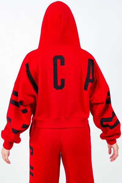 Back view of vibrant red American Bazi 'Chicago' cropped hoodie with bold black letters, showcasing urban style and comfort.