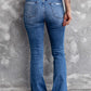 Back view of Bella Road Sequin Bow Distressed Bootcut Jeans showing slightly stretchy denim with distressed detailing on the pockets.