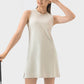 Millennia Round Neck Sleeveless Active Dress in light beige, perfect for workouts, featuring moderate stretch for comfort.