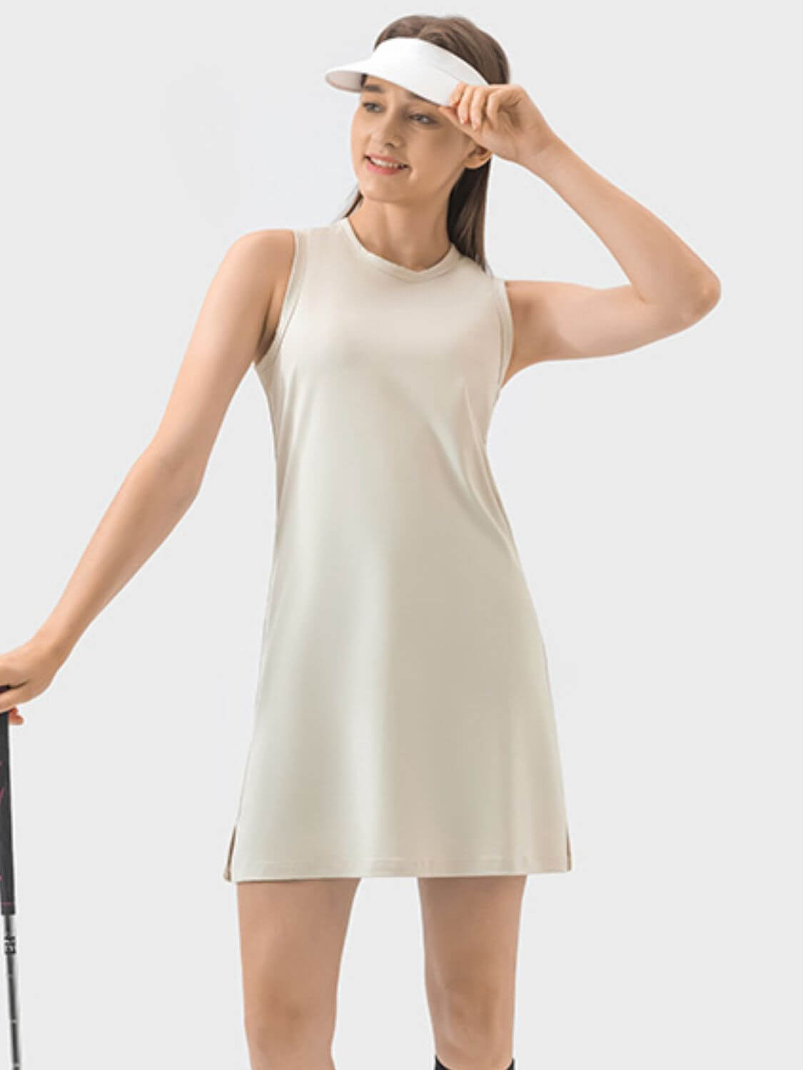 Millennia Round Neck Sleeveless Active Dress in light beige, perfect for workouts, featuring moderate stretch for comfort.