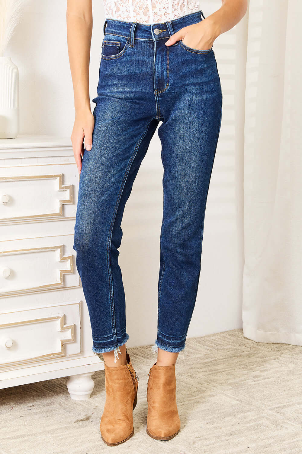 High Waist Released Hem Slit Jeans in deep indigo wash, flattering fit, worn with tan ankle boots - Judy Blue Jeans Style #88704