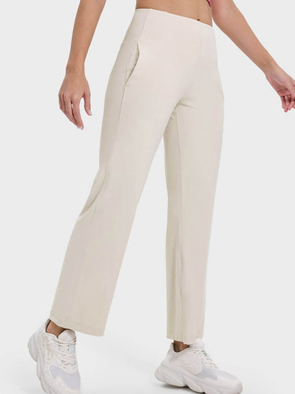 Millennia Pocketed High Waist Active Pants in light beige, featuring a flattering high waist and practical side pockets.