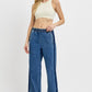 Stylish woman in elastic waist wide leg jeans, showcasing a trendy and comfortable casual look. Perfect for any occasion!