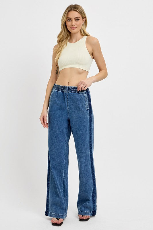 Stylish woman in elastic waist wide leg jeans, showcasing a trendy and comfortable casual look. Perfect for any occasion!