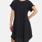 Woman wearing a black Fringe Edge High Low Flowy Dress with Pockets, showcasing its back and high-low hem design.