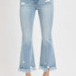 Plus size raw hem distressed cropped flare jeans in light wash, perfect for showcasing stylish footwear.