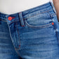 Close-up of Judy Blue plaid cuff straight leg jeans, showcasing mid-waist design and pockets for a stylish, functional look.