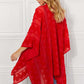 JUSTIN TAYLOR Pom-Pom Asymmetrical Poncho Cardigan in Red at Bella Road