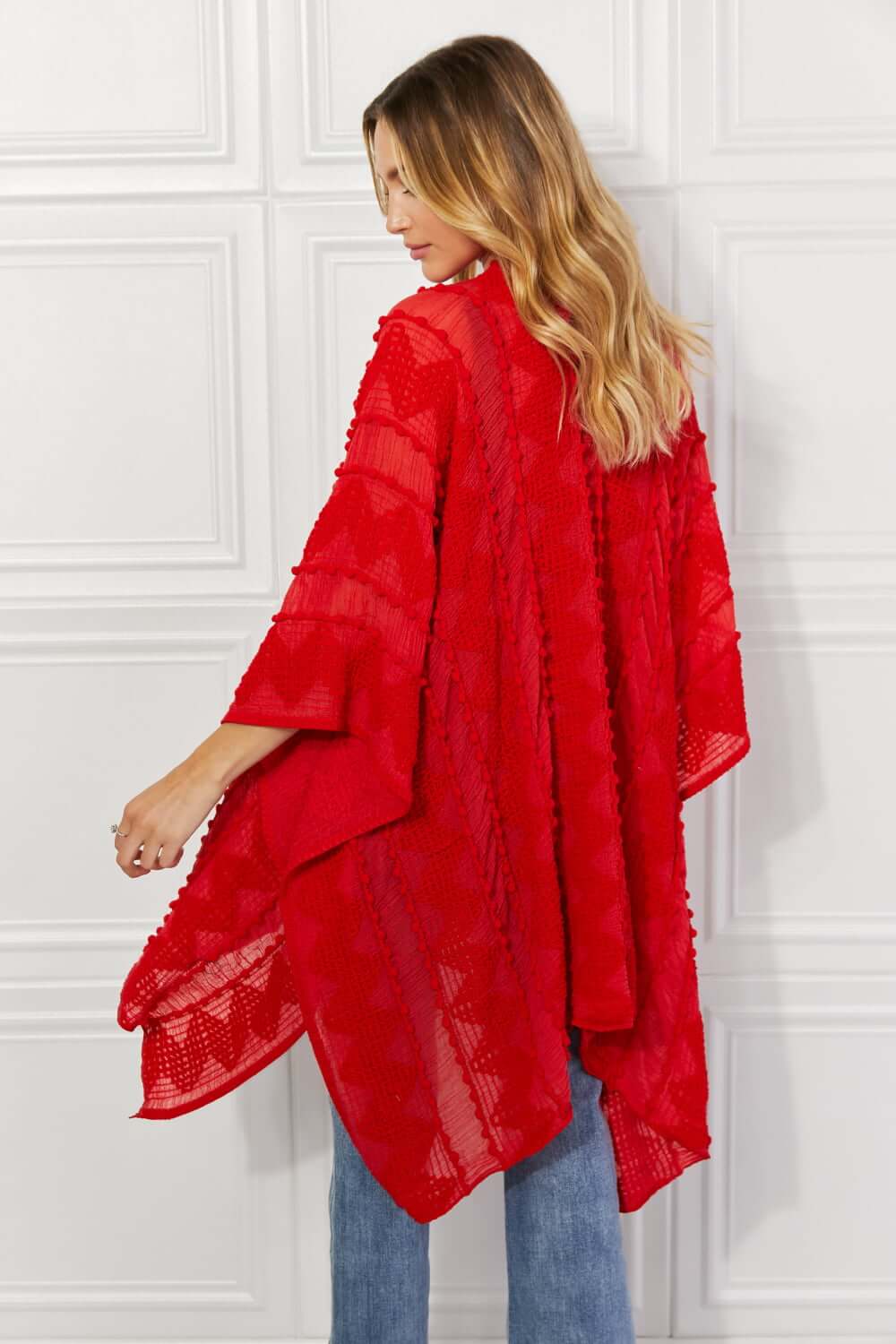 JUSTIN TAYLOR Pom-Pom Asymmetrical Poncho Cardigan in Red at Bella Road