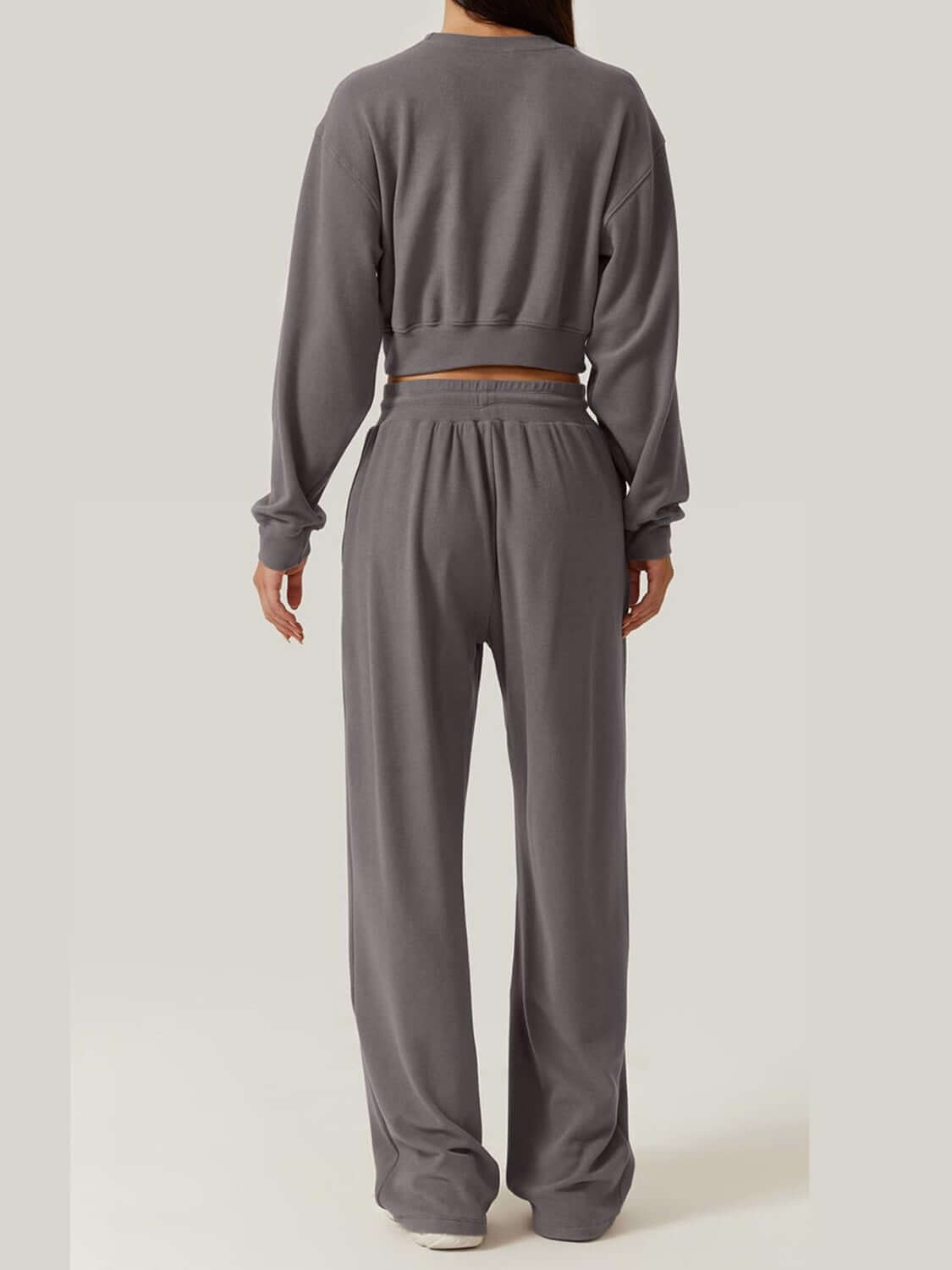 Back view of a gray Bella Road Crisscross Round Neck Top and Drawstring Pants Set made of 100% polyester