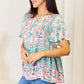 DOUBLE TAKE Floral Tie Neck Short Sleeve Blouse at Bella Road