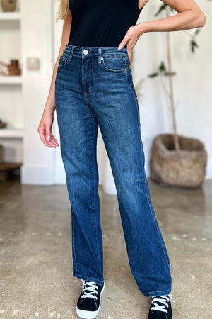 Woman wearing Tummy Control Straight Jeans by Judy Blue, showcasing flattering and slimming fit with timeless straight leg silhouette.