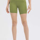 Millennia high waist training shorts in green, featuring a 5' inseam, perfect for workouts or lounging in comfort.