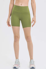 Millennia high waist training shorts in green, featuring a 5' inseam, perfect for workouts or lounging in comfort.