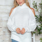 Woman wearing Bella Road Cable-Knit Turtleneck Cold Shoulder Sweater in white, perfect for chilly days and stylish comfort.