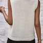 Back view of a chic white sleeveless turtleneck sweater vest with a cozy collar and central seam detail.