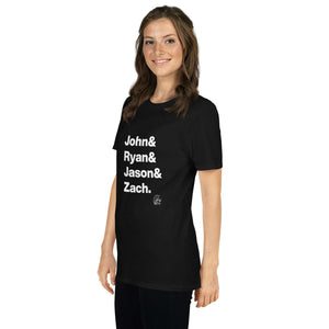 Woman wearing 'Americana Heroes' short-sleeve unisex t-shirt honoring John Prine, Ryan Adams, Jason Isbell, and Zach Bryan.