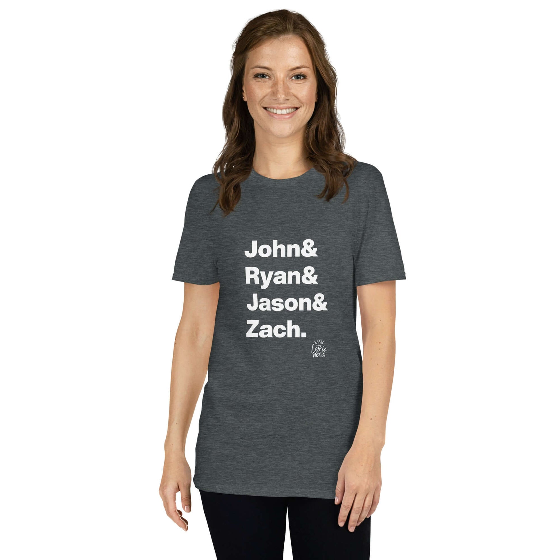 Woman wearing 'Americana Heroes' short-sleeve unisex t-shirt with names John, Ryan, Jason, Zach, honoring Americana music pioneers