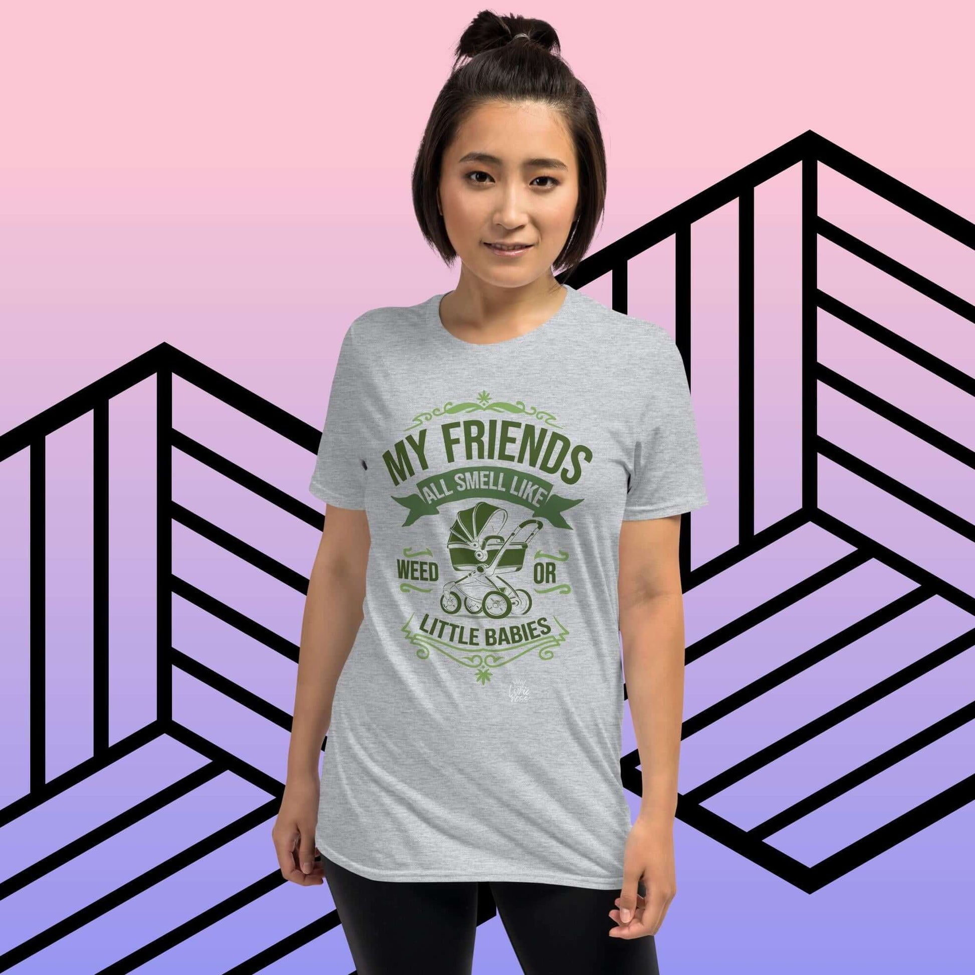 Woman wearing "My Friends All Smell Like Weed or Little Babies" short-sleeve unisex t-shirt against geometric background