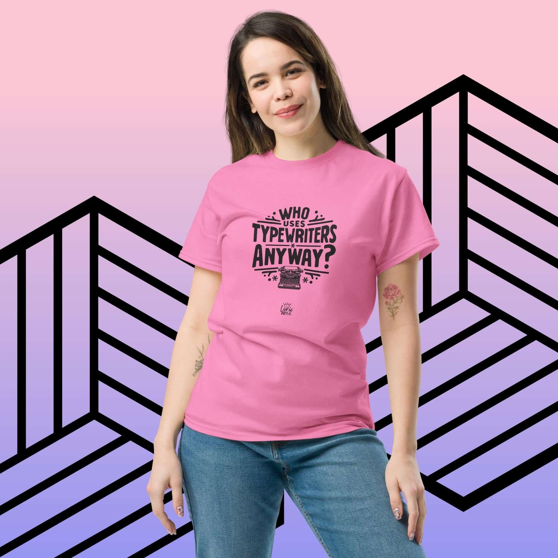 Woman wearing pink "Who Uses Typewriters Anyway?" short-sleeve unisex t-shirt against geometric background