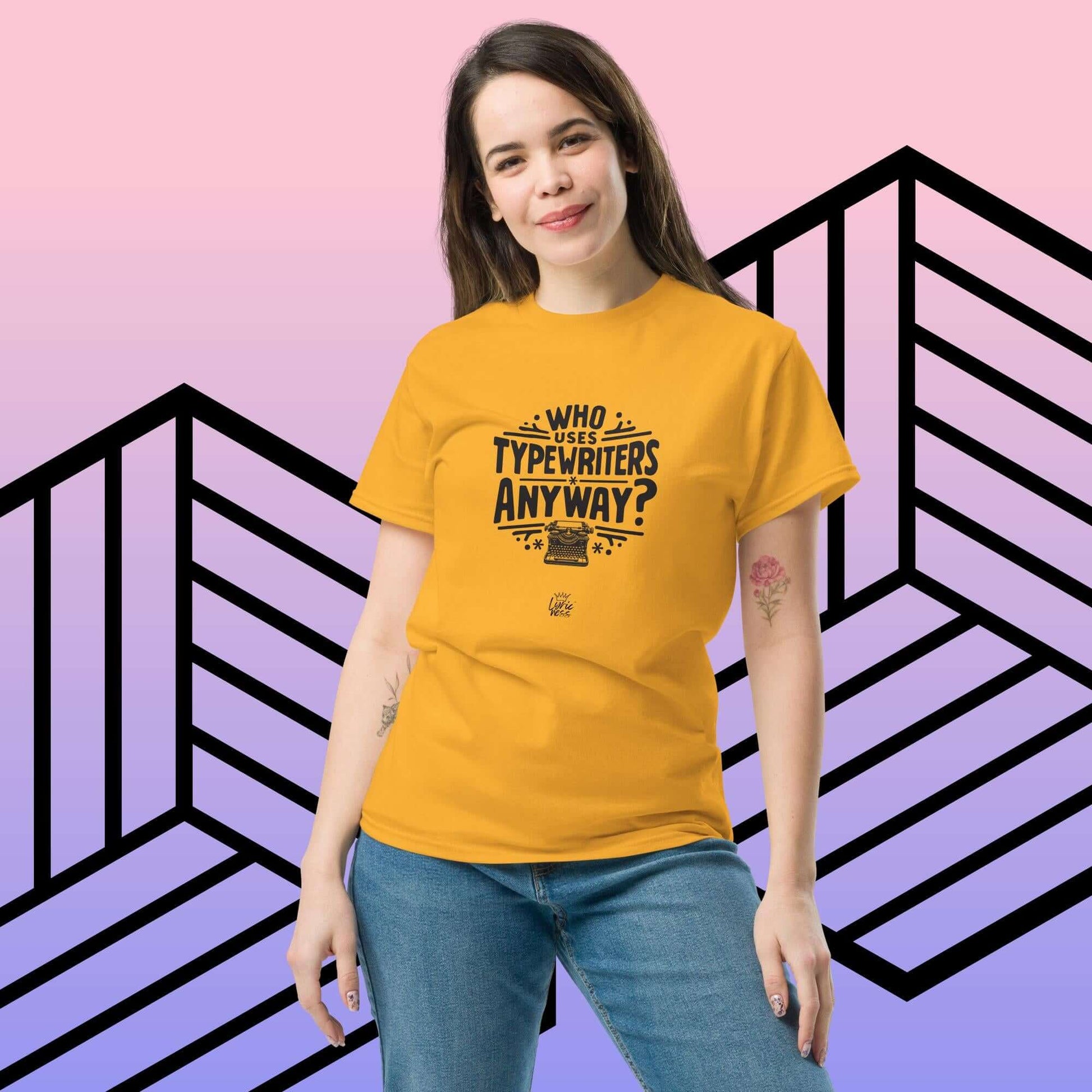 Unisex model wearing mustard 'Who Uses Typewriters Anyway?' short-sleeve t-shirt, perfect for trendy layered streetwear outfits.