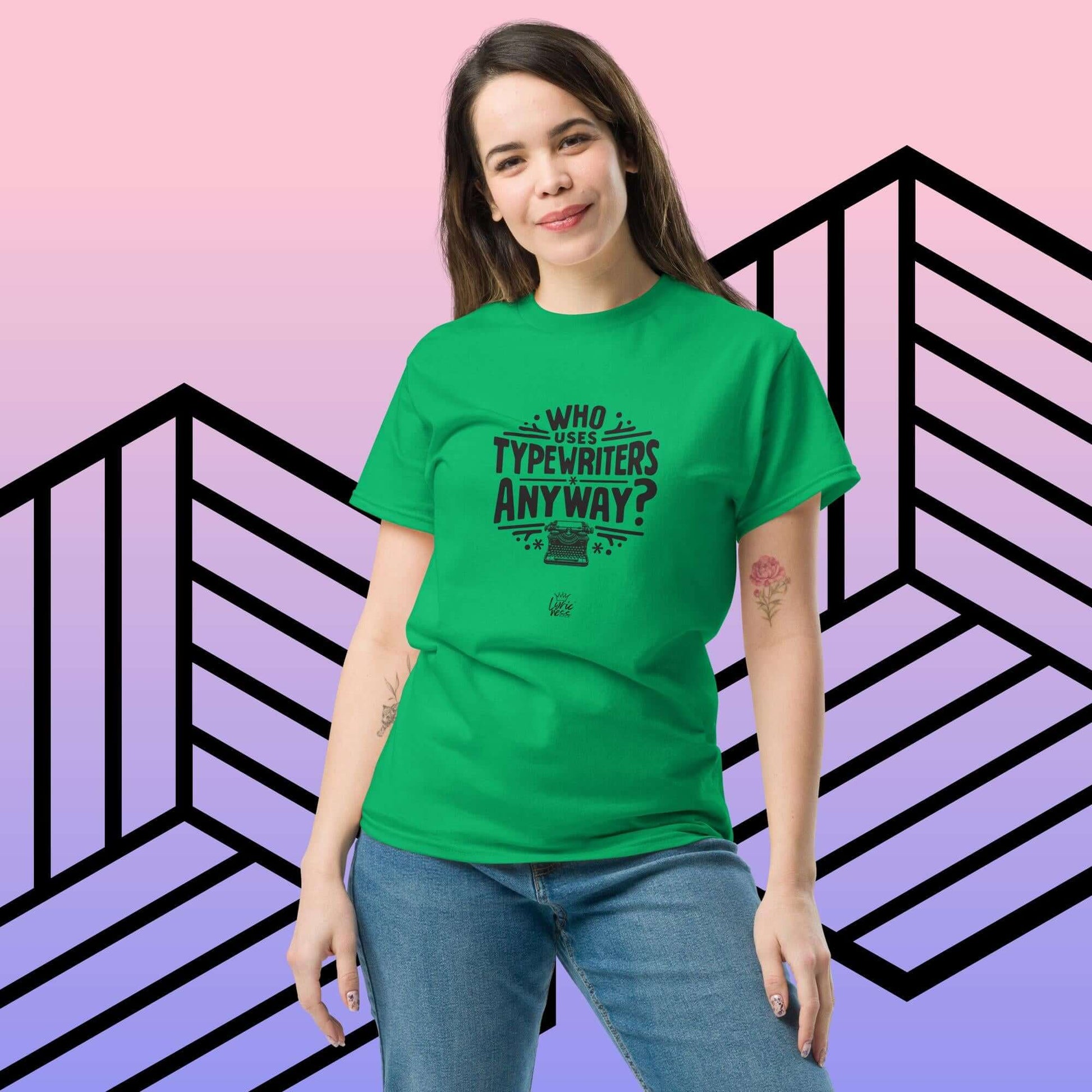 Woman wearing green "Who Uses Typewriters Anyway?" unisex T-shirt against geometric patterned background.