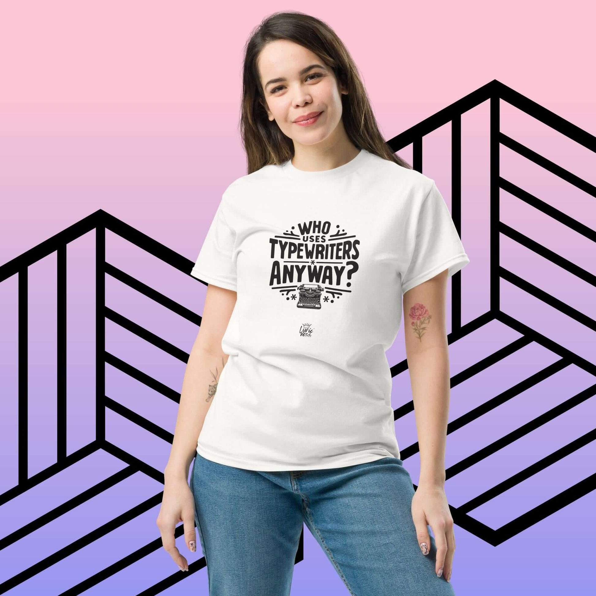 Unisex short-sleeve T-shirt with "Who Uses Typewriters Anyway?" text, worn by a model against a geometric background